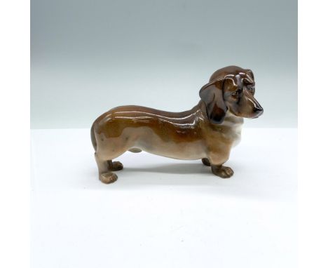 Standing Style 2, Model number 36. This large retired figurine has a glossy finish and Royal Doulton backstamp. Issued: 1928-