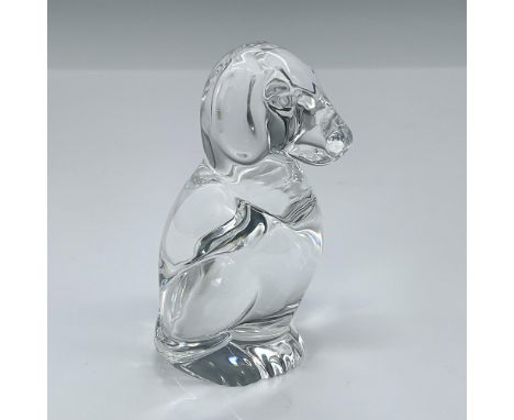 Crystal figurine showcasing man's best friend. Inspired by historical hand-cooling practices where young ladies used glass to