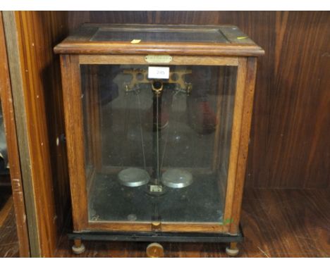 AN OAK CASED VINTAGE SET OF SCALES