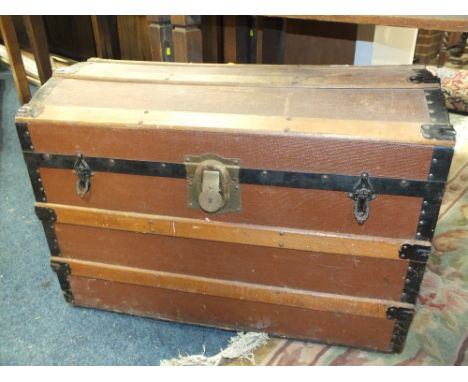 A VINTAGE WOODEN BANDED DOMED TRUNK