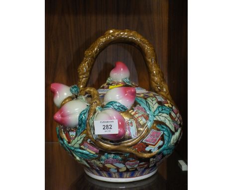 AN UNUSUAL ORIENTAL CERAMIC TEAPOT WITH CHARACTER MARK TO BASE