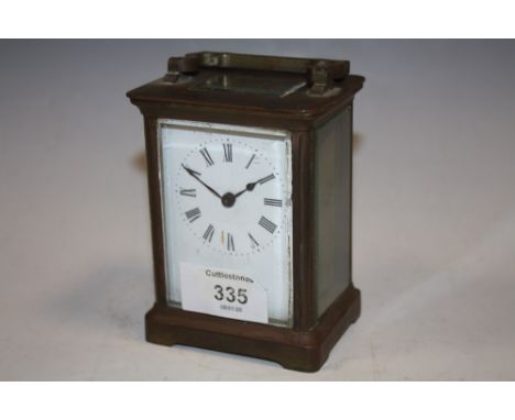 A SMALL BRASS CARRIAGE CLOCK