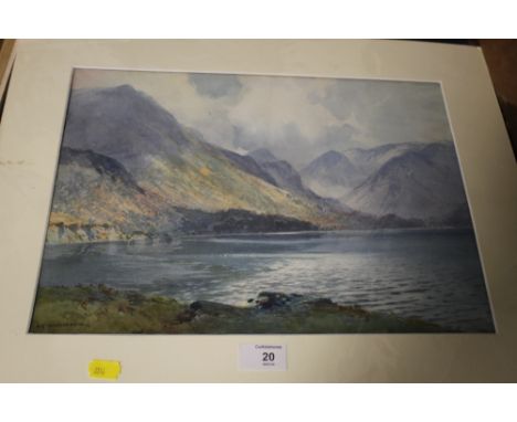 AN UNFRAMED MOUNTED WATERCOLOUR OF A MOUNTAINOUS LAKE SCENE SIGNED H R WILKINSON LOWER LEFT