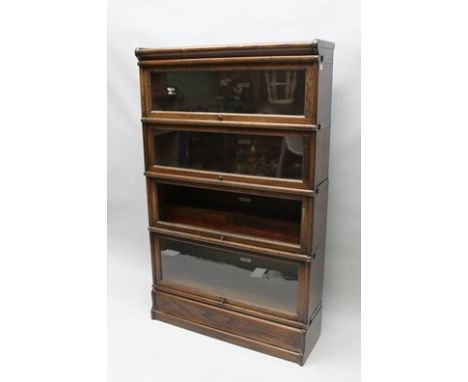 A GLOBE-WERNICKE OAK FOUR TIER GLASS FRONTED BOOKCASE of typical form and construction, 142cm x 87cm 