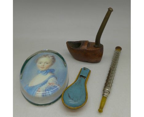 A wooden pipe, cigarette holder, paperweight and whistle