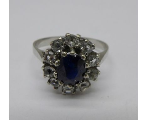A white metal blue and white stone cluster ring, 1.9g, K