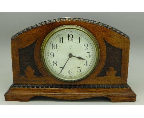 A wooden mantel clock, marked Payne, Penge on dial