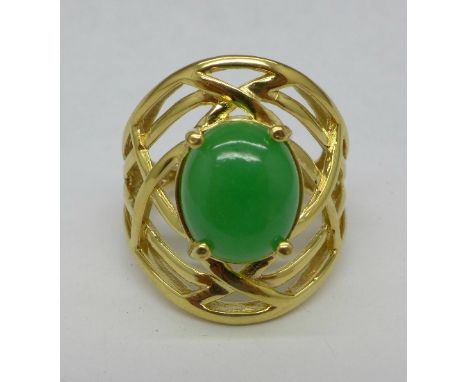 A silver gilt and jade ring, O