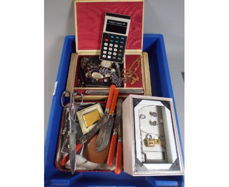 A Box of Curios to Include Jewellery Box and Costume Jewellery, Pen Knives, Butter Knives, Casio Calculator Etc. 