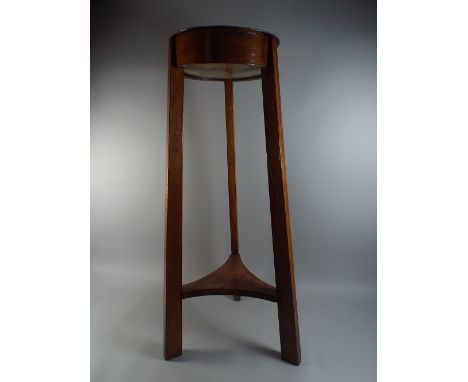 An Edwardian Circular Oak Planter with Copper Insert.