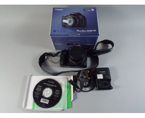 A Canon Power Shot SX40 HS Digital Camera with Original Box Instructions Disk Etc. 