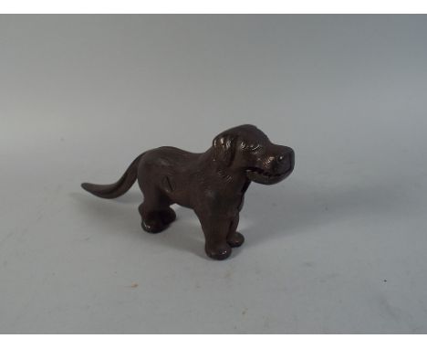 A Cast Metal Nut Cracker in The Form of A Dog.