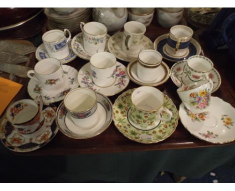 A Tray Containing Twelve Coffee Cans and Saucers.