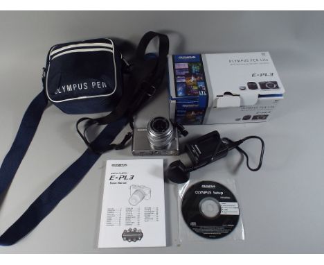 An Olympus 107 Lite E-PL3 Digital Camera with Olympus 14-42 mm Lens, Carrying Case and Charger, Box Etc.