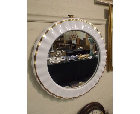 A Ceramic Framed Wall Mirror.