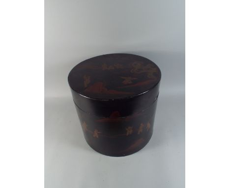An Oriental Chinese Circular Lacquered Hat Box Decorated with Figures Playing Games. 
