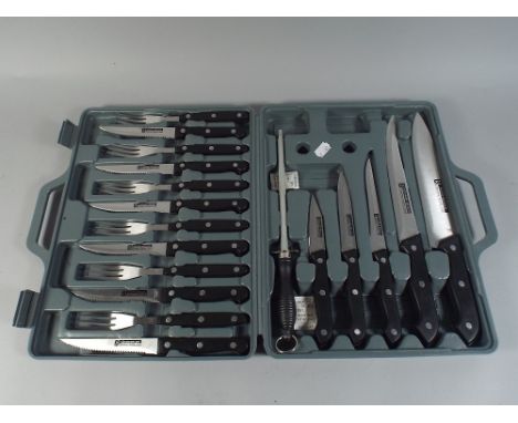 A Cased Carving and Steak Knife and Fork Set.