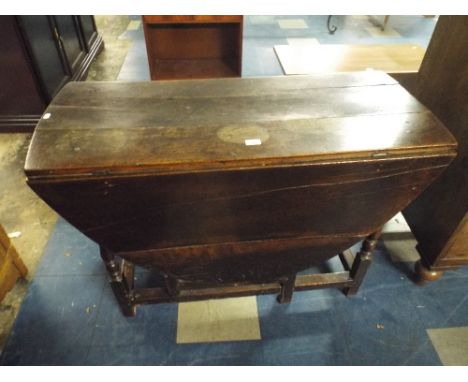 A Period Oak Drop Leaf Gate Leg Dining Table.