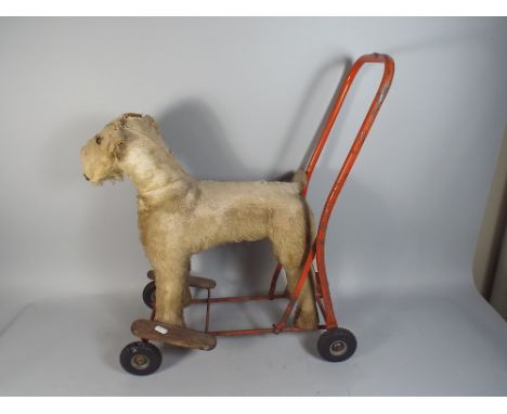 A Vintage Lines Brothers Push Along Dog.