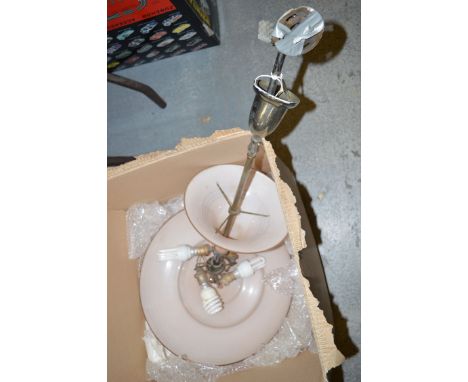 A glass electric light fitting.