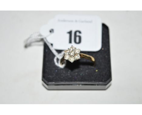 A diamond cluster ring, the brilliant cut diamonds weighing a total of approximately 0.75 carats, on 9ct. yellow gold shank, 