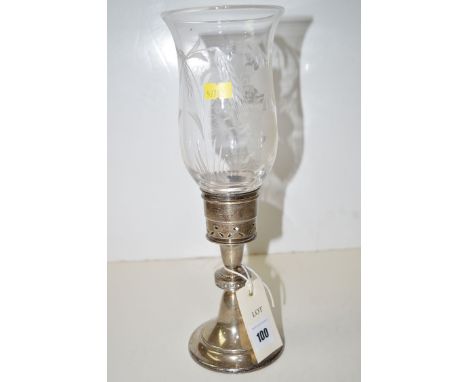 A silver candlestick, the pierced sconce holding cut glass baluster form shade, the knop stem with Lindisfarne decoration abo
