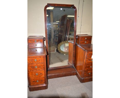 A Victorian Duchess style dressing chest with large central arched swing mirror in reeded frame, two jewellery drawers in eac