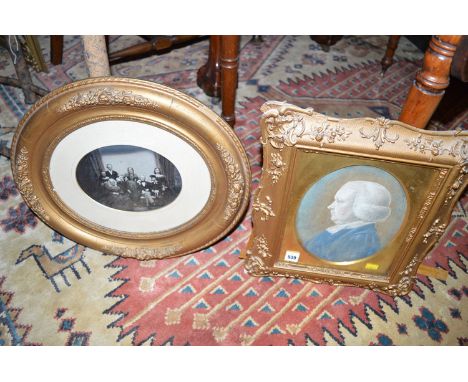 A 19th Century pastel portrait of a clergyman; together with a Victorian photographic family portrait, inscribed with the sit