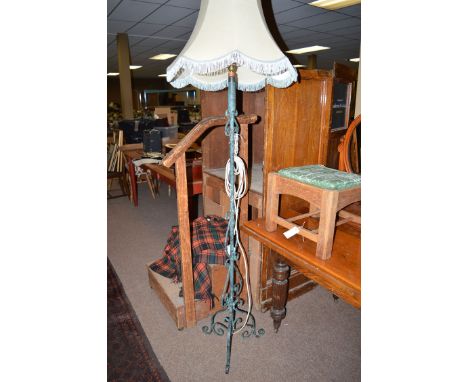 A green painted metal standard lamp and shade.