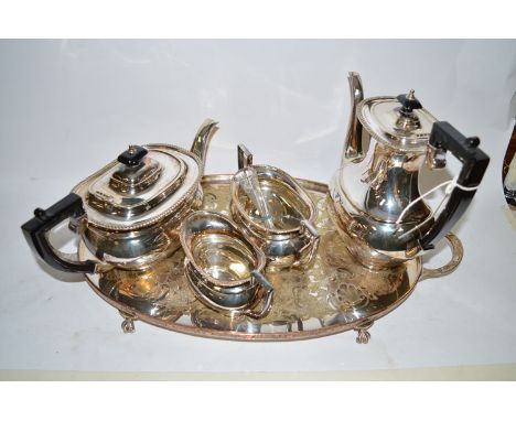 A four-piece oval EPNS tea service, with plain body and beaded rims, together with an oval two-handled tray; a set of six tea