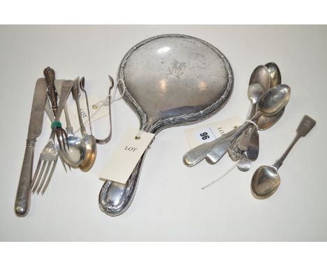 A silver-backed dressing table hand mirror; together with various silver spoons, mainly teaspoons; silver forks, including a 