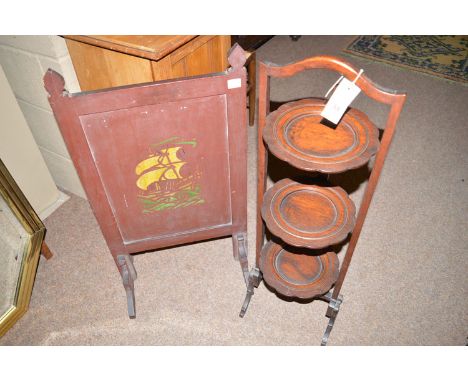 A three-tier stained wood folding cake stand; together with a firescreen.