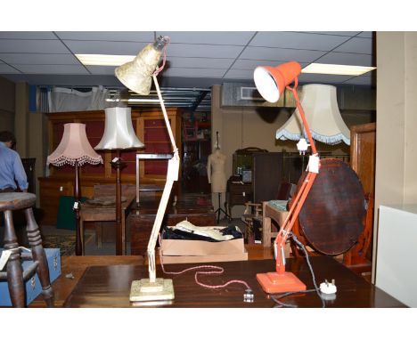 A red anglepoise lamp; together with an early 20th century anglepoise lamp.  (2)