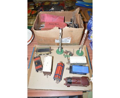 A Hornby series clockwork railway engine and rolling stock; together with track and accessories.