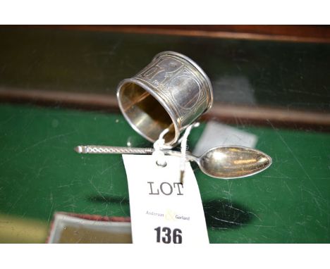 A Russian silver napkin ring, Moscow, master mark A.P 1887, decorated with Cyrillic writing; together with a Russian silver t