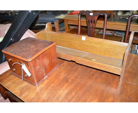 An oak book trough; together with a miniature mahogany chest of two drawers with turned wooden handles.