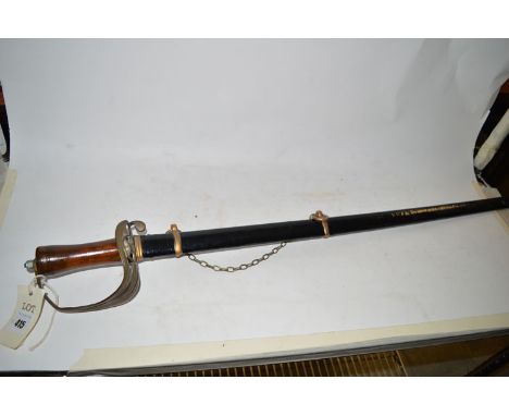 A sword with an engraved blade, by Sherlock & Co., with turned wooden handle and metal scabbard.