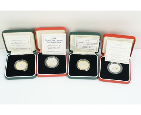 A collection of four Royal Mint Queen Elizabeth II £2 silver proof coins to include 1994, 1996, 1999 and 2001 examples, all e