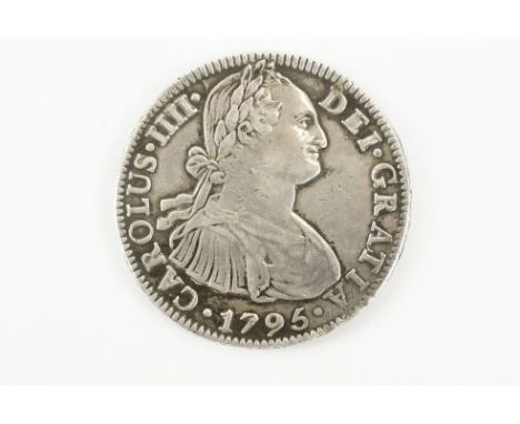 A Mexican colonial Carlos IIII 1796 silver 8 reales coin. 