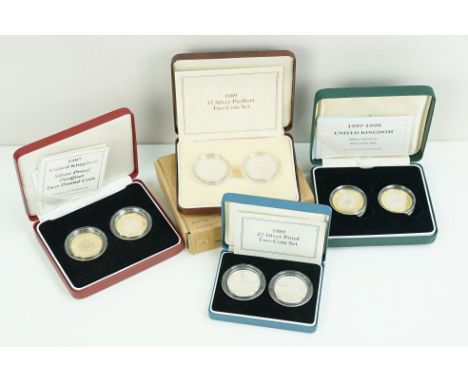 A collection of four Royal Mint Queen Elizabeth II £2 silver proof coin two coin sets to include 1989, 1997, 1998 and 1989 ex