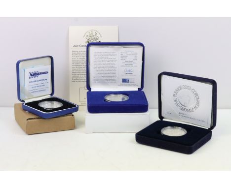A collection of three Royal Mint United Kingdom Queen Elizabeth II silver proof commemorative £5 / Crown coins to include 199