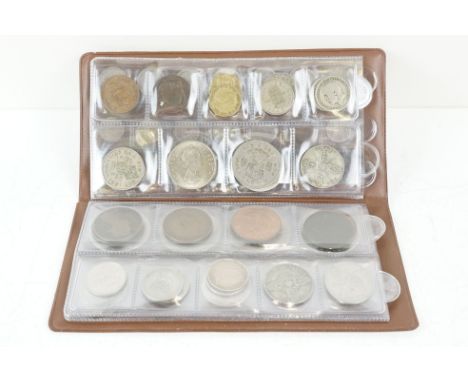 A collection of British decimal and pre decimal coins within a coin album to include King George II Maundy coins and silver e
