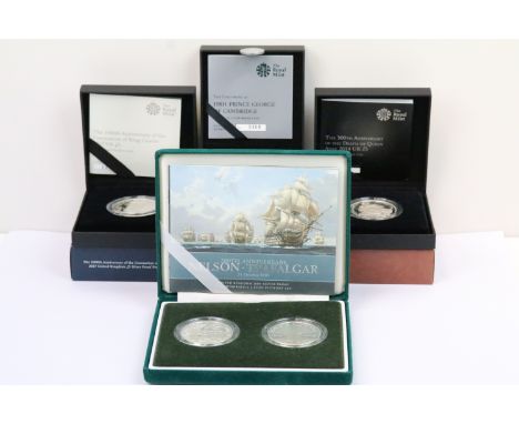 A collection of four Royal Mint Queen Elizabeth II £5 silver proof coins to include 2013, 2014, 2017 and 2005 two coin set ex