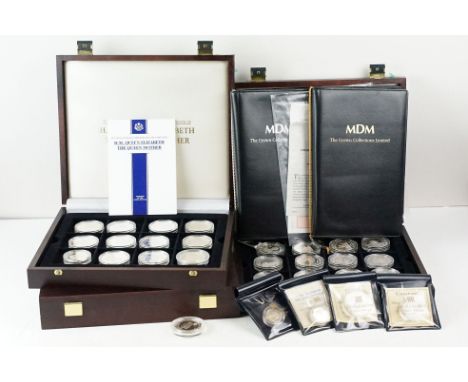 A large collection of over fifty silver proof coins to include Crowns, $10, £5 and £1 examples, all encapsulated and complete