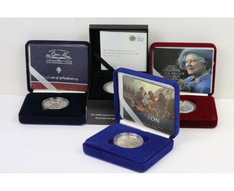 A collection of four Royal Mint Queen Elizabeth II £5 silver proof coins to include 2005, 2016, 2002 and 2000 examples, all e