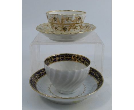 A Flight period Worcester tea bowl and saucer, decorated in blue and gilt to a white ground, marked Flight and a crescent, to