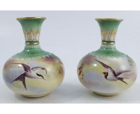 A pair of Royal Worcester Hadley ware vases, of squat form, decorated with Swallows and pine cones, dated 1905, one af, heigh