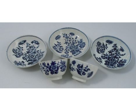 Three First period Worcester porcelain saucers, together with two tea bowls, decorated in the Three Flowers pattern, with blu