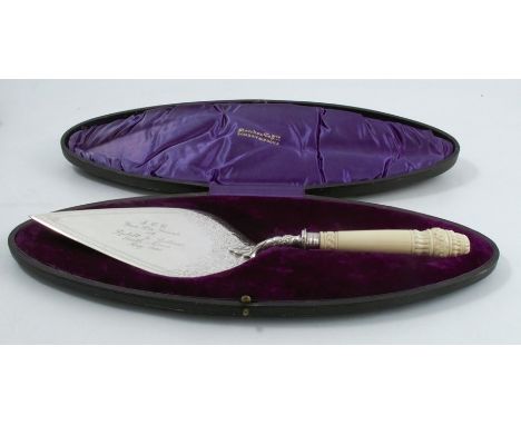 A cased presentation silver trowel, with engraved description and decoration, with carved ivory handle, Sheffield 1894, maker
