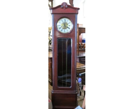 An Edwardian mahogany long case clock, with circular dial and glazed door with Westminster chimes, height 80ins 